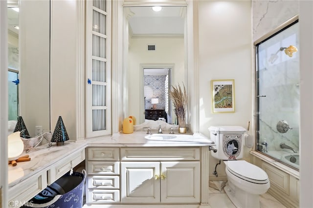 full bathroom with vanity, toilet, shower / bath combination with glass door, and ornamental molding