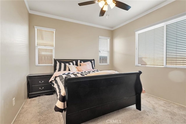 carpeted bedroom featuring ornamental molding and ceiling fan