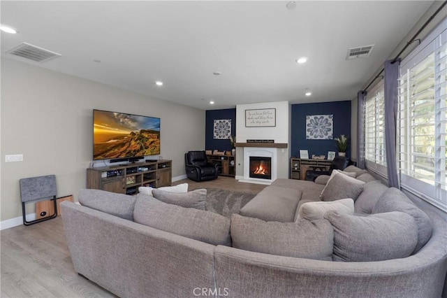 living room with light hardwood / wood-style flooring