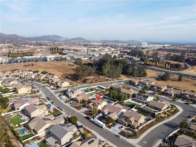 birds eye view of property with a mountain view