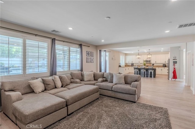 living room with light hardwood / wood-style floors