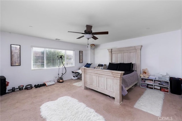 bedroom featuring ceiling fan and light carpet