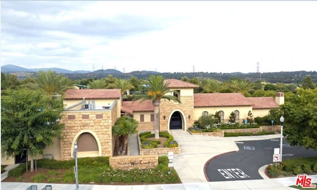 mediterranean / spanish-style home featuring a mountain view