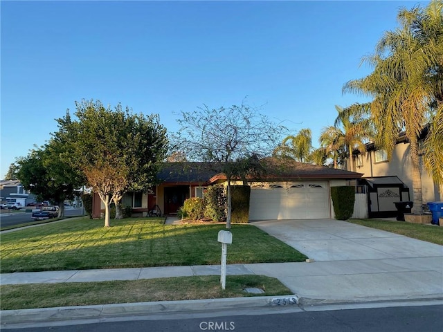 view of front of property featuring a garage and a front lawn