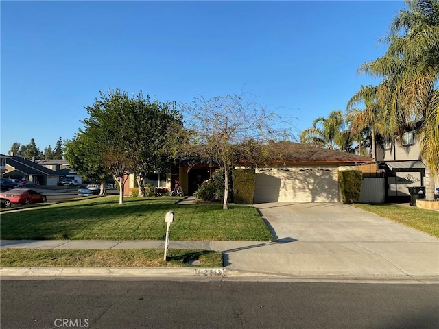 obstructed view of property featuring a garage and a front lawn