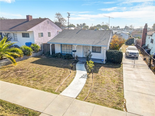 single story home featuring a front yard