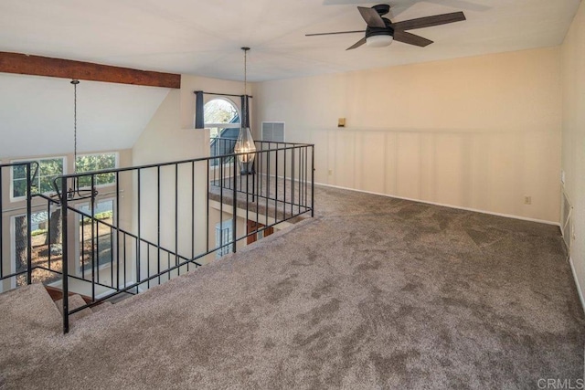 hallway featuring carpet and lofted ceiling with beams