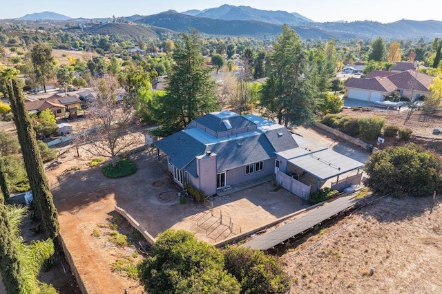 drone / aerial view featuring a mountain view