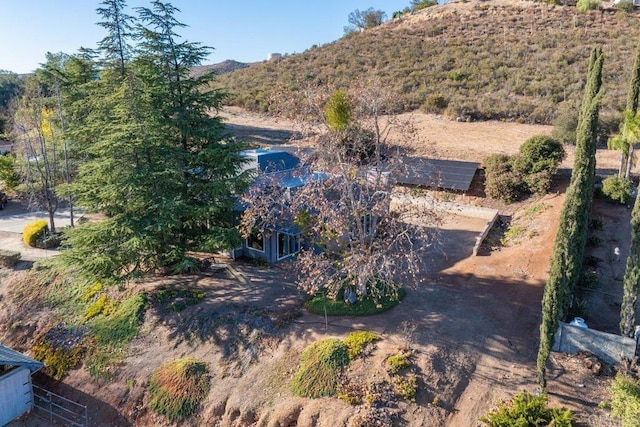 birds eye view of property with a mountain view