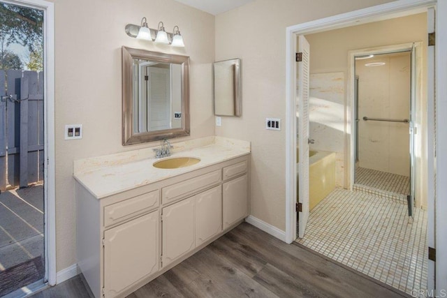 bathroom with vanity and hardwood / wood-style flooring