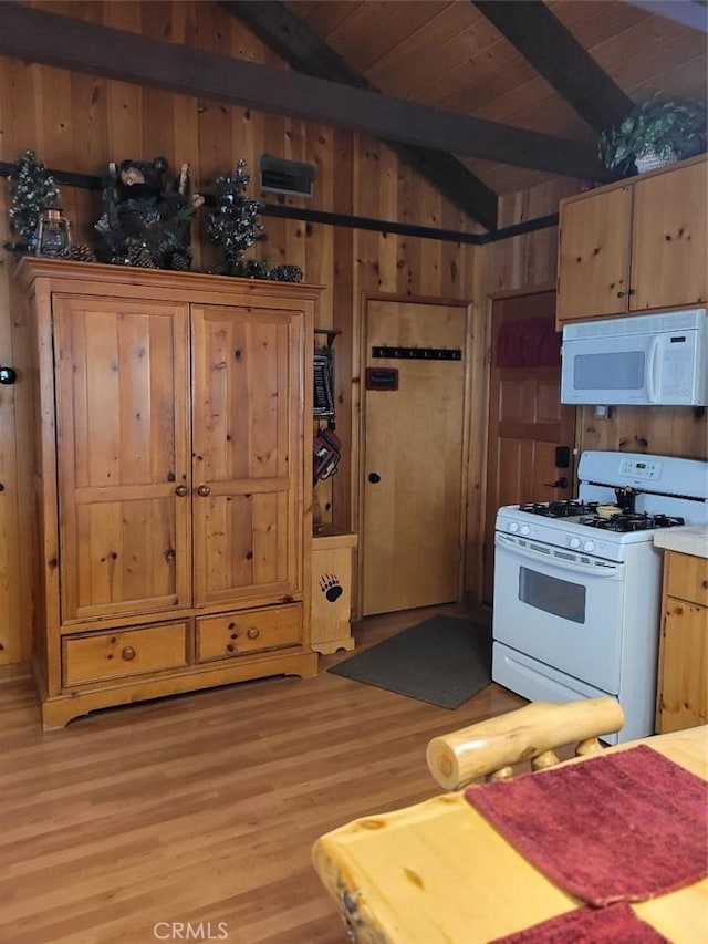 kitchen featuring wood walls, white appliances, lofted ceiling with beams, light hardwood / wood-style floors, and wood ceiling