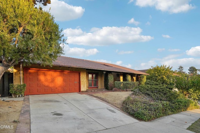 single story home featuring a garage