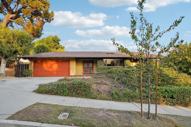 ranch-style home featuring a garage