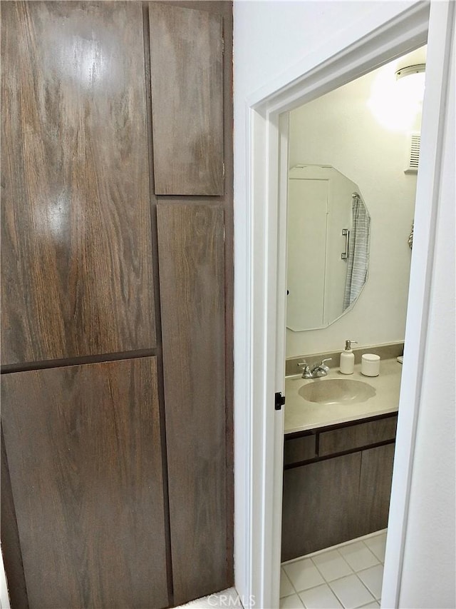 bathroom with vanity and tile patterned floors