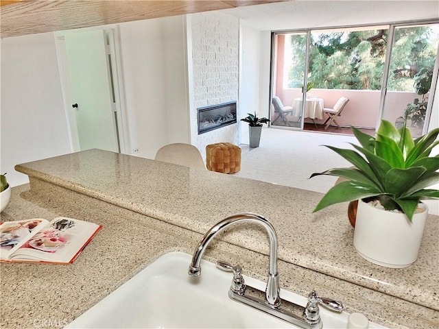 room details with a tiled fireplace and sink