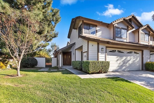 view of front of property featuring a garage and a front yard