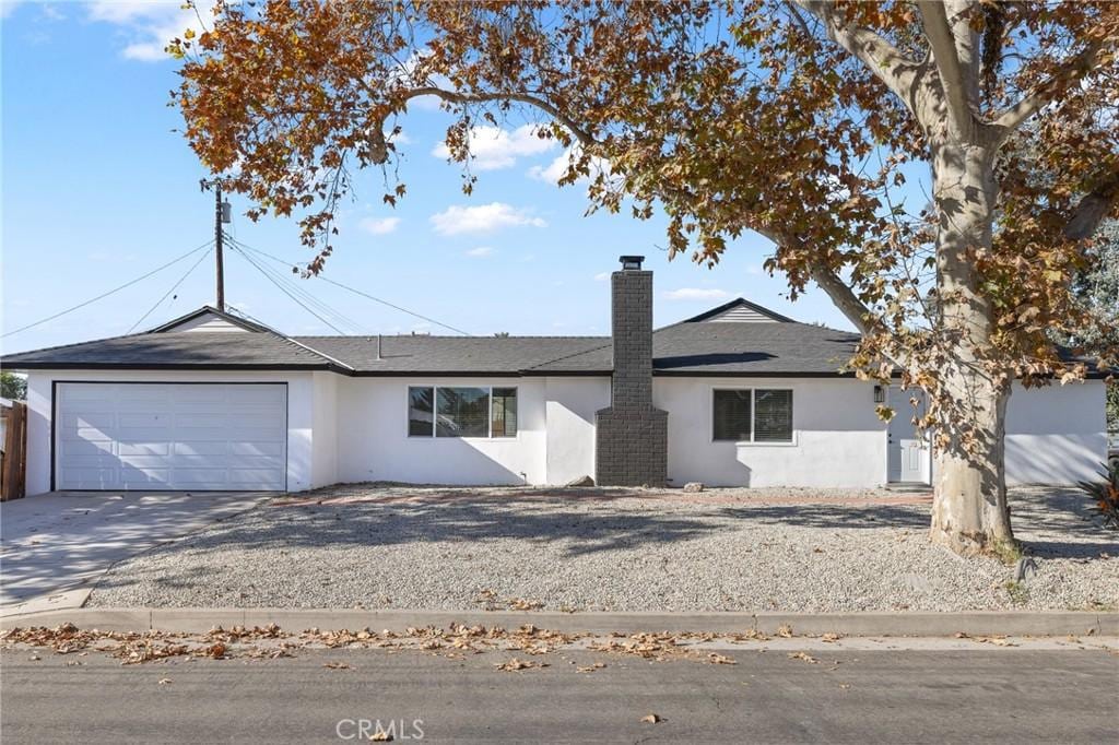 single story home with a garage