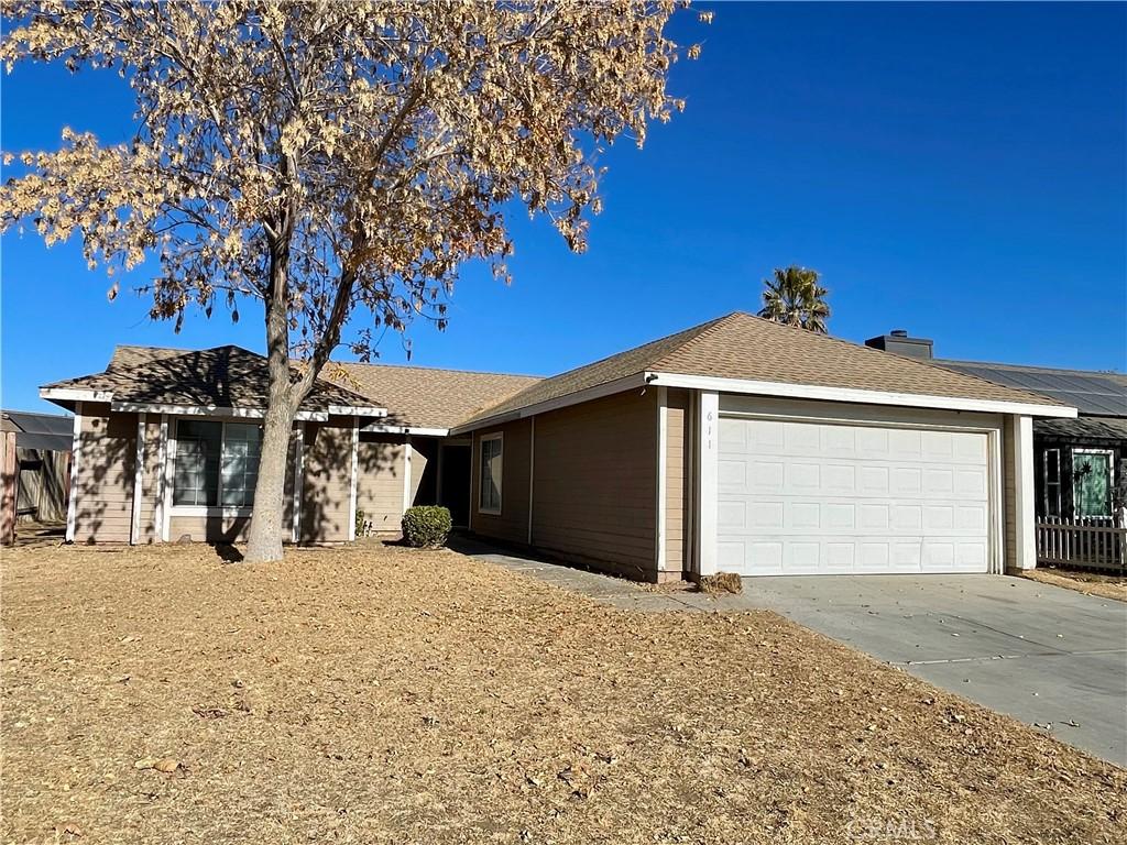 ranch-style house featuring a garage