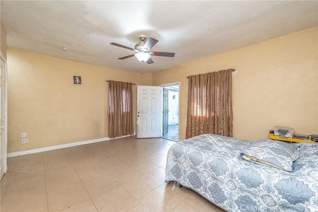 tiled bedroom with ceiling fan