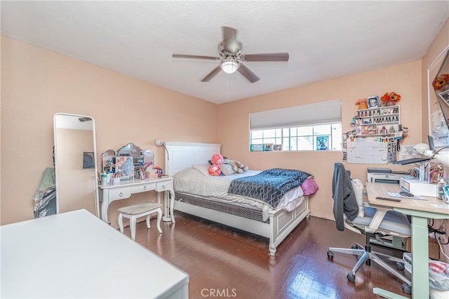 bedroom featuring ceiling fan and dark wood-type flooring