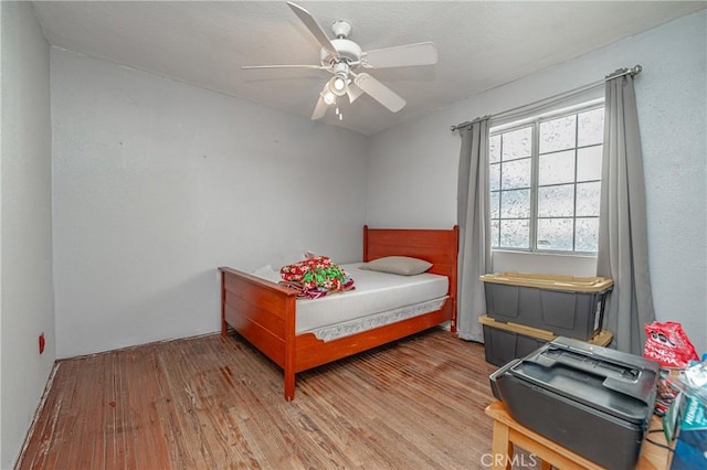 bedroom featuring ceiling fan and light wood-type flooring