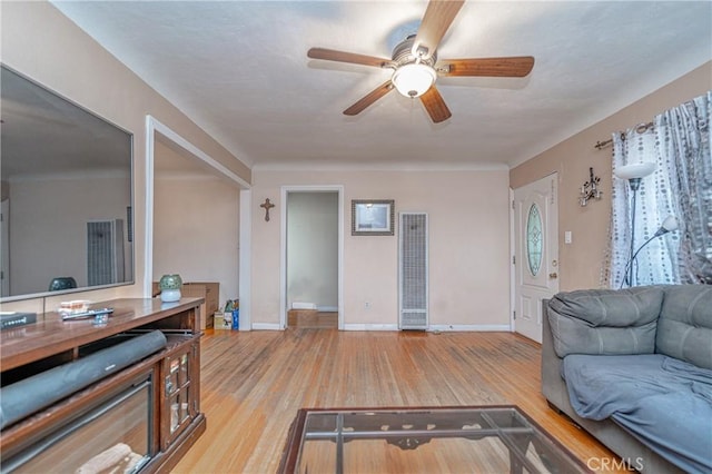 living room featuring light wood-type flooring and ceiling fan