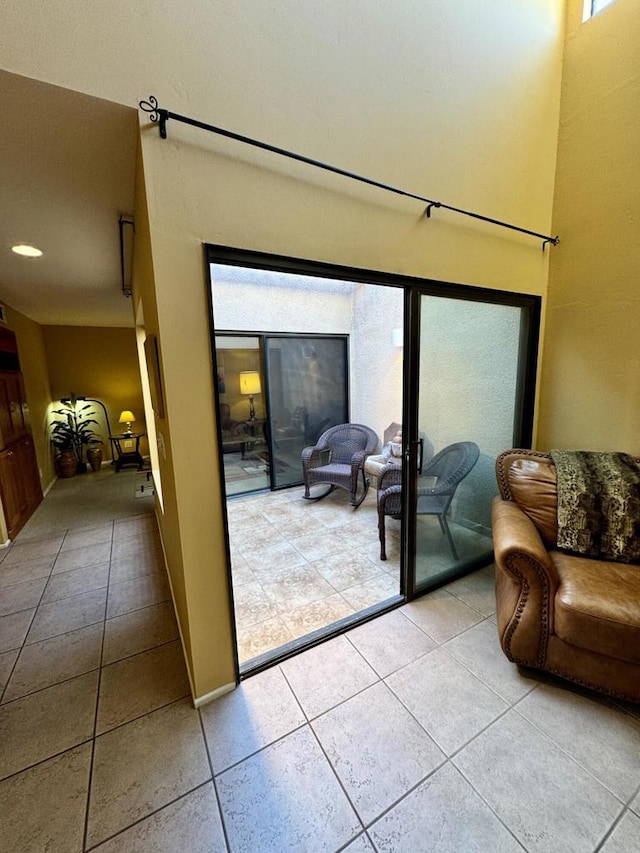 entryway with light tile patterned flooring