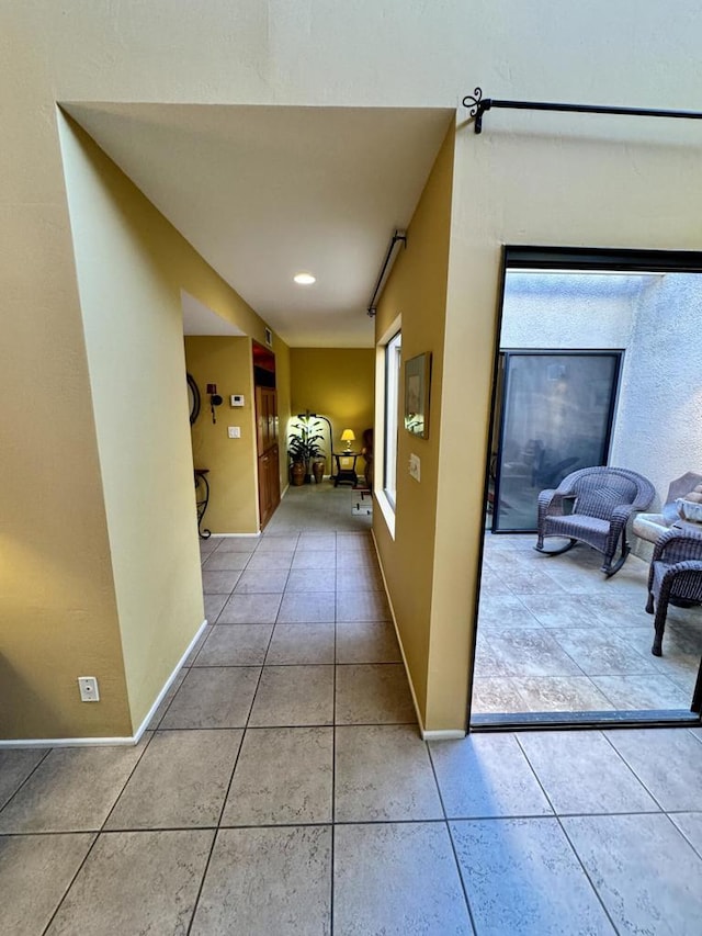 hall featuring tile patterned floors