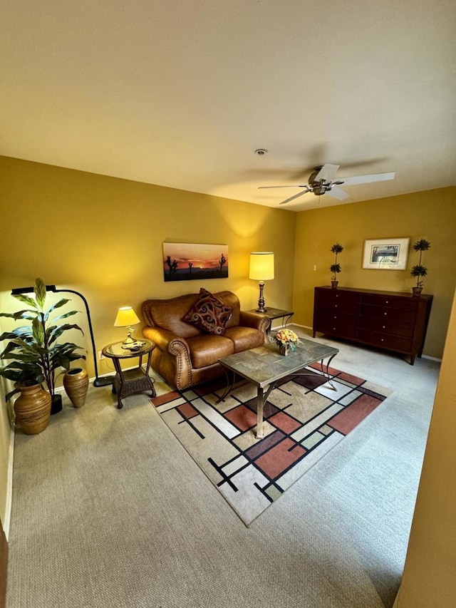 living room featuring ceiling fan and carpet floors