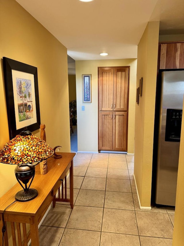 hallway featuring light tile patterned floors