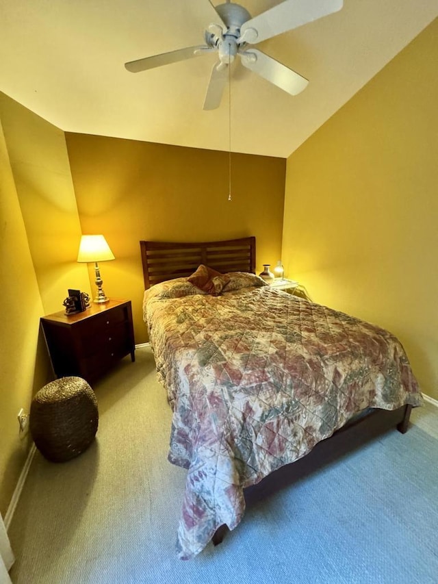 carpeted bedroom featuring ceiling fan and lofted ceiling