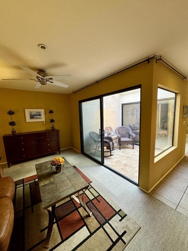 living room featuring ceiling fan and carpet floors