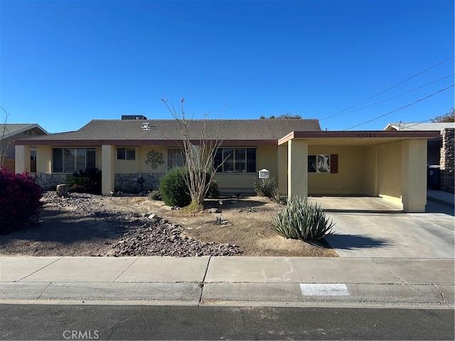 single story home featuring a carport