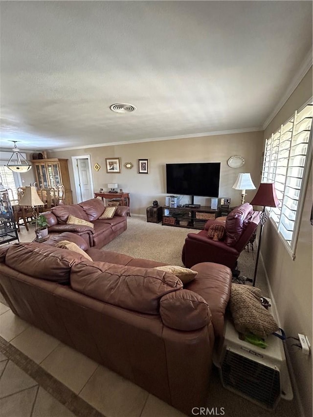 living room with tile patterned flooring and ornamental molding