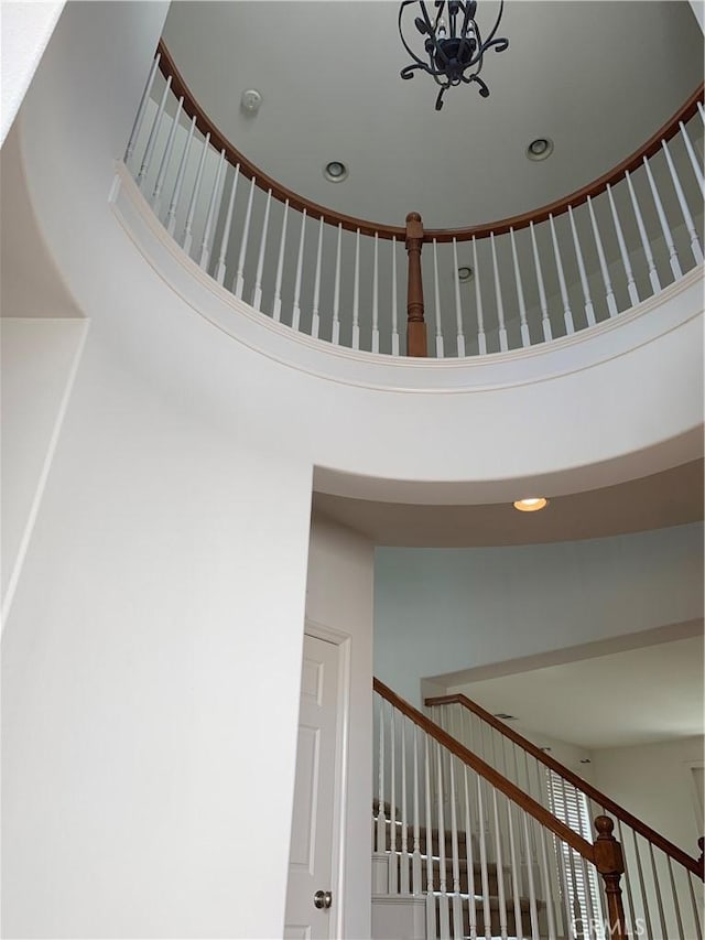 stairs featuring a high ceiling