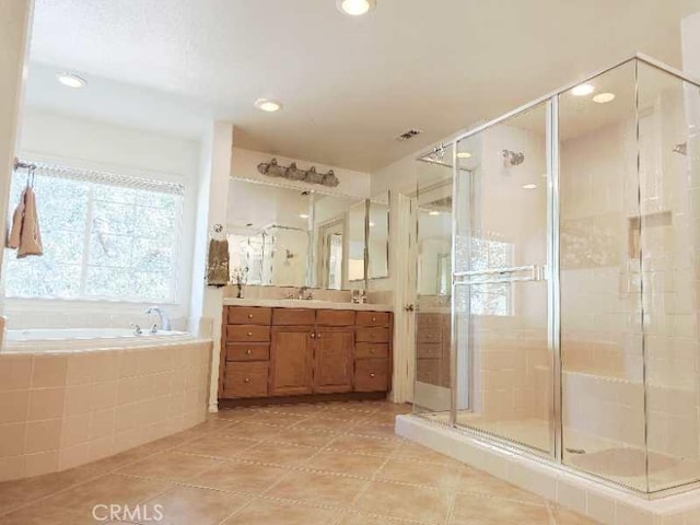 bathroom featuring separate shower and tub, tile patterned floors, and vanity