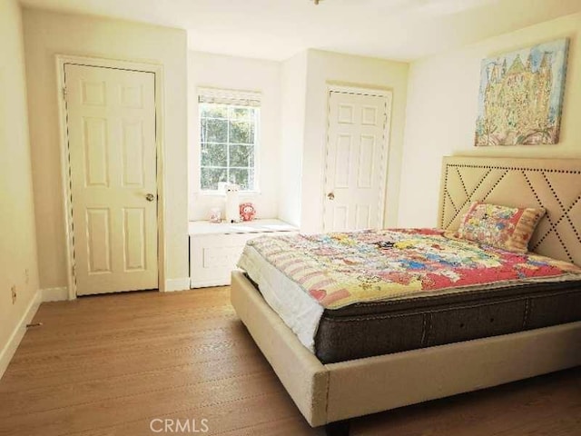 bedroom featuring hardwood / wood-style floors