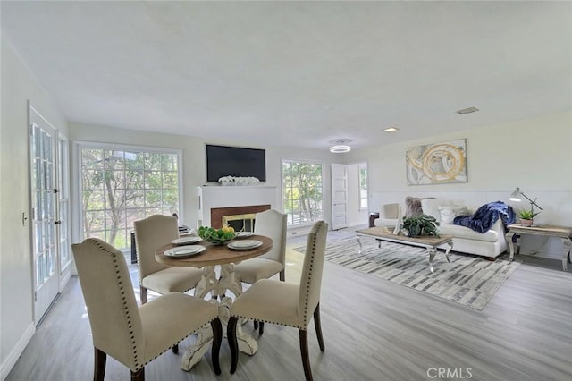 dining space with light hardwood / wood-style flooring