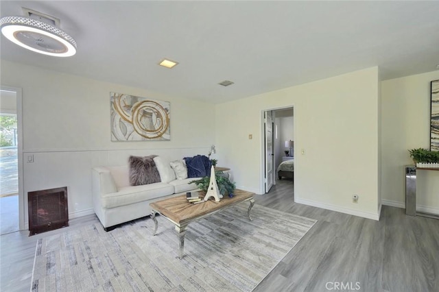 living room with light hardwood / wood-style floors