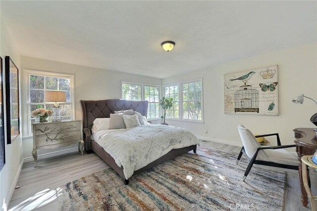 bedroom with light hardwood / wood-style flooring