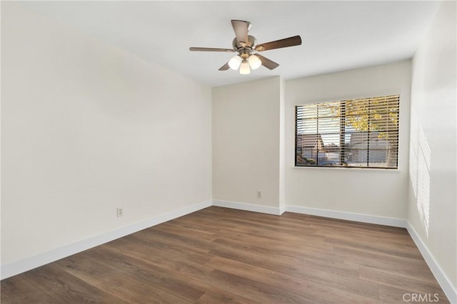 empty room featuring ceiling fan and hardwood / wood-style floors