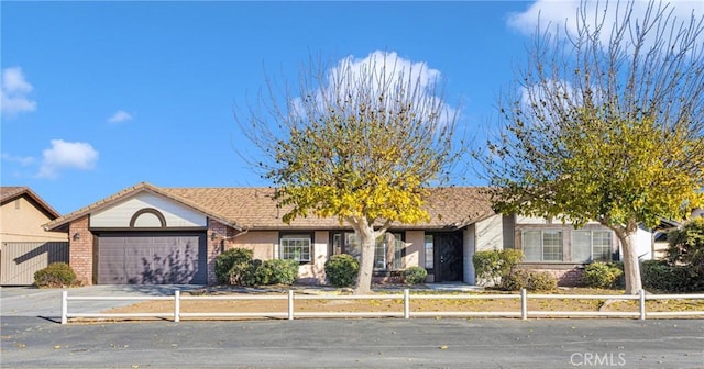 single story home with a garage