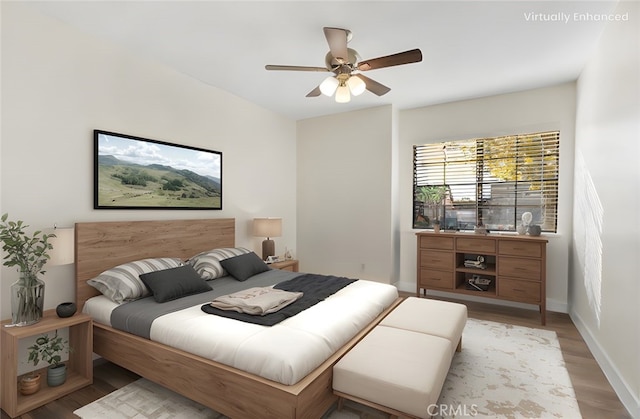 bedroom featuring ceiling fan and light hardwood / wood-style floors