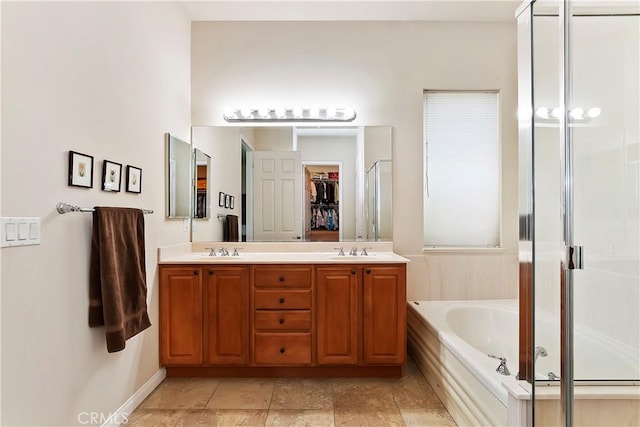 bathroom featuring vanity and separate shower and tub