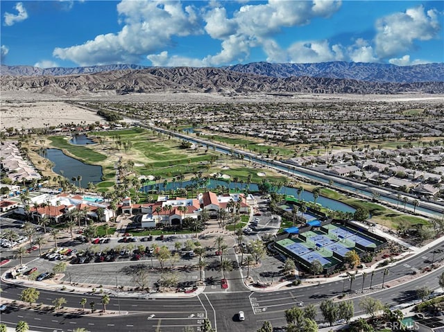 aerial view featuring a water and mountain view