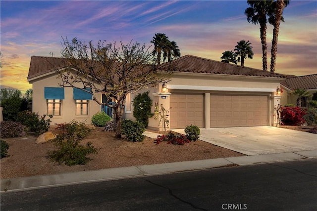 mediterranean / spanish house featuring a garage