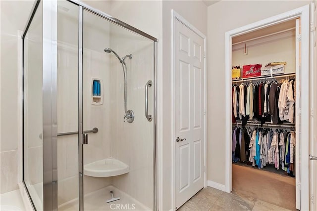 bathroom featuring tile patterned flooring and walk in shower