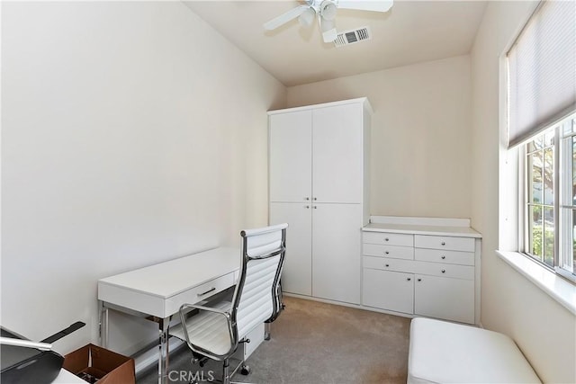 office area with light carpet and ceiling fan