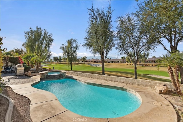 view of pool with an in ground hot tub, a yard, and a patio