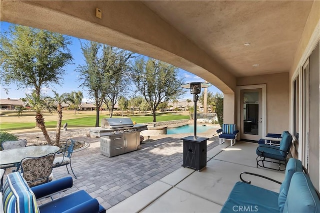 view of patio featuring a grill